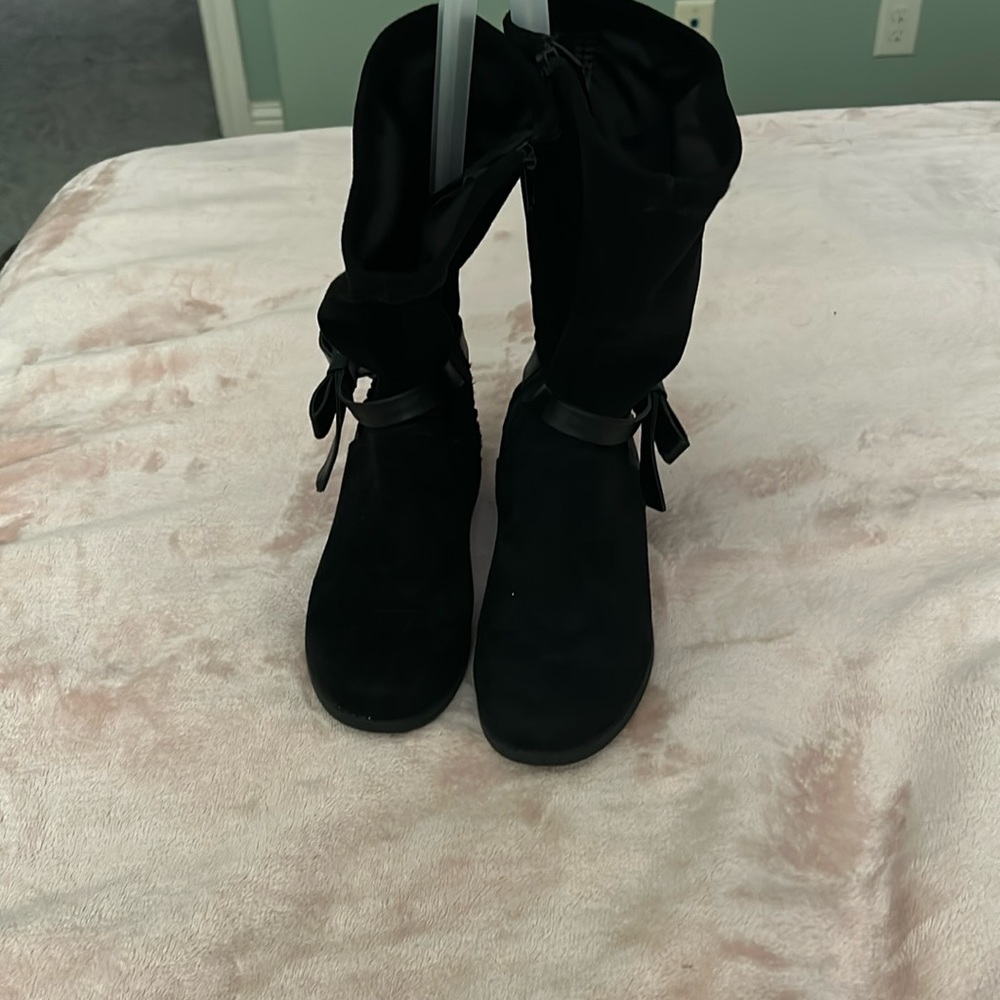 Black sparkly zip up boots with a bow